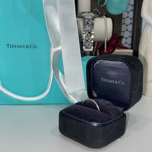 Tifanny & Co platinum Diamond wedding band.